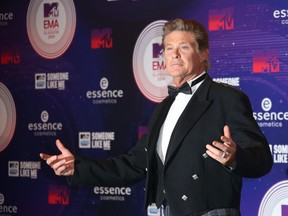 FILE - In this Nov. 9, 2014 file photo, actor David Hasselhoff poses for photographers upon arrival at the 2014 MTV European Music Awards in Glasgow. Hasselhoff will be making a big splash on TV next month. To mark the American debut of his U.K. series, "Hoff the Record," on AXS TV, the channel says it will salute the "Baywatch" star with a March 26, 2016, mini-marathon starting at 3 p.m. EST.