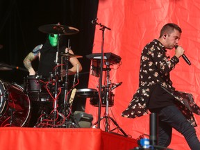Twenty One Pilots' Tyler Joseph, right, and Josh Dun perform at the Austin City Limits Music Festival in Zilker Park in Austin, Texas. (Photo by Jack Plunkett/Invision/AP)