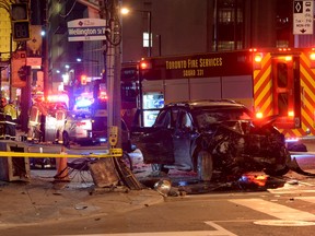 Emergency crews at the scene of a collision at Bay and Wellington Sts. in Toronto Sunday, March 20, 2016. (Andrew Collins photo)