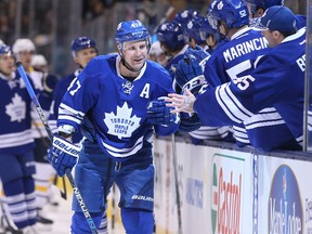 Toronto Maple Leafs centre Leo Komarov (47) is congratulated by teammates on the bench after scoring a goal against the Buffalo Sabres March 7, 2016 at Air Canada Centre. (Tom Szczerbowski-USA TODAY Sports)