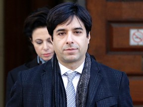 Jian Ghomeshi exits Old City Hall after closing arguments in his trial on Thursday, February 11, 2016. (Craig Robertson/Toronto Sun)