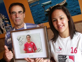 Olivia Greaves with her sponsor, Kosta Kanaras of Goody's Restaurant at Bay View Mall. Kanaras is helping offset the costs of Greaves playing for Team Canada at the U19 women's world floorball championships in Belleville in May. (Paul Svoboda/The Intelligencer)