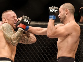 Chad Laprise, right, of Chatham, Ont., battles Ross Pearson during UFC Fight Night 85 in Brisbane, Australia, on March 19, 2016. (MATT ROBERTS/USA Today)
