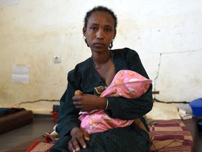 Debre Mekuria breastfeeds her malnourished baby in Seriel health centre in Ethiopia's northern Amhara region February 13, 2016. Picture taken February 13, 2016. REUTERS/Tristan Martin