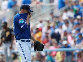 Toronto Blue Jays starting pitcher Marco Estrada reacts after giving up a two-run home run against the Pittsburgh Pirates during a game at Florida Auto Exchange Park in Dunedin, Fla., on March 20, 2016. (Kim Klement/USA TODAY Sports)