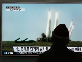 A man watches a TV screen showing file footage of the missile launch conducted by North Korea, at Seoul Railway Station in Seoul, South Korea, Monday, March 21, 2016. North Korea fired five short-range projectiles into the sea on Monday, Seoul officials said, in a continuation of weapon launches it has carried out in an apparent response to ongoing South Korea-U.S. military drills it sees as a provocation. (AP Photo/Lee Jin-man)