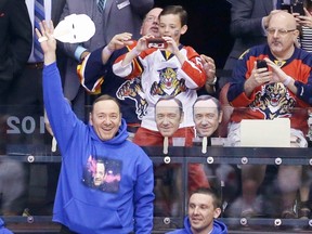 Actor Kevin Spacey waves to the fans during an NHL hockey game between the Florida Panthers and the Detroit Red Wings in Sunrise, Fla., Saturday, March 19, 2016. (AP Photo/Alan Diaz)