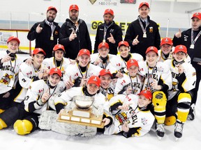 The Mitchell Bantams captured the 2015-16 Ontario Minor Hockey Association (OMHA) ‘CC’ championship on home ice last Saturday, March 19 with a 4-3 win over Bancroft in Game 3 of their best-of-five series. Team members are (back row, left to right): Scott MacLean (assistant coach), Joe Schoonderwoerd (coach), Colin Weir (manager), Chris Vogels (trainer) and Jody Catalan (trainer). Middle row (left): Tyler Roobroeck, Declan Catalan, Ryan Harmer, Calvin McCorkindale, Jacob Rauser, Connor Weir and Jarett Vogels. Front row (left): Drew MacLean, Zach Dow, Carter Schoonderwoerd, Jackson MacArthur, Reid Ramseyer, Eric Gettler and lying on ice is goalie James Copeland.  ANDY BADER/MITCHELL ADVOCATE