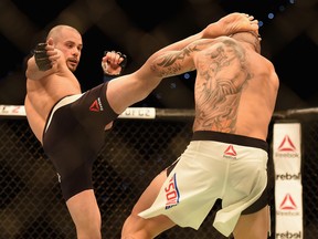 Ross Pearson (red gloves) competes against Chad Laprise (blue gloves) during UFC Fight Night at Brisbane Entertainment Centre Mar 20, 2015 in Brisbane, Australia. Mandatory Credit: Matt Roberts-USA TODAY Sports