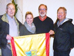 West Perth residents Pete Huitema, Dr. Carrah Templeman, Dr. John Hohner and Rob Templeman pose for a picture with the Guatemalan town of Mataquescuintla's flag. SUBMITTED
