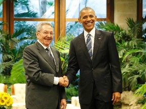 U.S. President Barack Obama and Cuba's President Raul Castro shake hands during their first meeting on the second day of Obama's visit to Cuba, in Havana March 21, 2016.  REUTERS/Carlos Barria