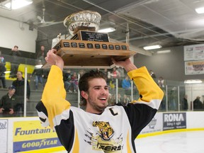 Vermilion Credit Union Midget Tigers’ Captain Darren Frankiw hoists the championship trophy after defeating the Lloydminster Eagle Well Service Blazers in the North Eastern Alberta Hockey League’s Midget Tier I league finals at Vermilion Stadium on Friday, Mar. 18.