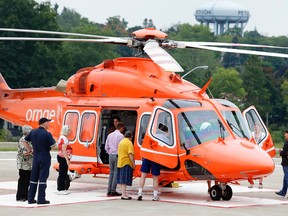 Visitors get a closer look at an Ornge air ambulance on display at the Peterborough Regional Health Centre August 29, 2015. (Clifford Skarstedt/Postmedia Network)