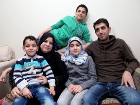 The latest Syrian refugee family to arrive in Kingston, at their apartment, are Yahya Al Jalam, his wife Afaf Al Jiboui and their children Ibrahim, 13, Reem, 10 and five-year-old Abdel-Rahim. (Ian MacAlpine/The Whig-Standard)