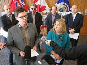 City councillors (left-to-right) Jason Schreyer, Matt Allard, Ross Eadie, Shawn Dobson, Cindy Gilroy and Russ Wyatt discuss problems with the budget. (Brian Donogh/Winnipeg Sun)