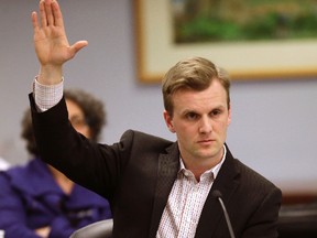 Councillor Joe Cressy votes at the Board of Health meeting dealing with supervised injection sites on Monday, March 21, 2016. (Craig Robertson/Toronto Sun)