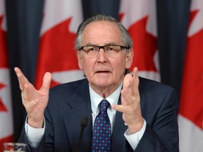 Former Supreme Court Justice Ian Binnie speaks at a news conference in Ottawa on Monday, March 21, 2016. An independent arbitrator's report into disputed senator expenses was released Monday after being reviewed by a Senate committee that oversees the upper chamber's finances. THE CANADIAN PRESS/Adrian Wyld