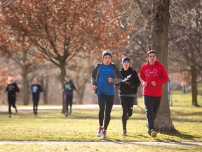 Young athletes from the London Legion Track and Field club warm up in the blustery cool weather before doing hill repeats in Gibbons Park in London, Ont. on Monday March 21, 2016. 
Mike Hensen/The London Free Press/Postmedia Network