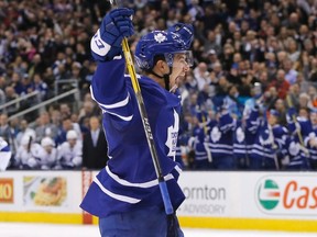 Maple Leafs defenceman Connor Carrick celebrates scoring his first goal as a Leaf in a recent 4-1 win over Tampa Bay at the Air Canada Centre. Carrick grew up playing minor hockey against teammate Garret Sparks and has since been reunited with the goaltender in Toronto. (THE CANADIAN PRESS/PHOTO)