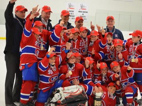 The Kingston Canadians celebrate after winning the Ontario Minor Hockey Association minor atom AA title in Caledon on Friday night. (Supplied photo)