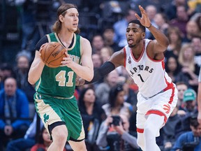 Boston Celtics forward Kelly Olynyk looks to pass as Toronto Raptors forward Jason Thompson moves in during first-quarter action at Air Canada Centre in Toronto on March 18, 2016. (Peter Llewellyn/USA TODAY Sports)