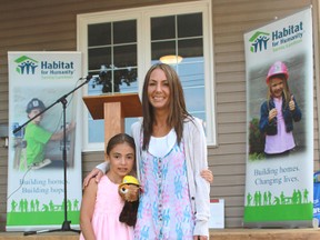 Megan Johnston and her daughter Tori, pictured in 2014 during a Habitat for Humanity ceremony.
CARL HNATYSHYN/SARNIA THIS WEEK