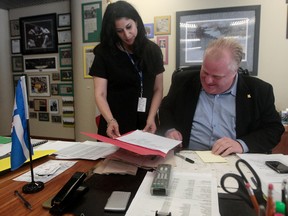 Toronto Mayor Rob Ford in his office with his press secretary -- and current Toronto Sun Editor -- Adrienne Batra at City Hallon ay 26, 2011.(Dave Abel/Toronto Sun)