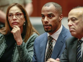 In this March 23, 2015, file photo, former NFL safety Darren Sharper, center, is flanked by his attorneys, Lisa Wayne, left, and Leonard Levine, right, in Los Angeles Superior Court. A federal judge rejected a plea deal Thursday, Feb. 18, 2016, in the rape case against the former NFL star, saying the possible nine-year sentence doesn't reflect the seriousness of the alleged crimes. (AP Photo/Nick Ut, Pool, File)
