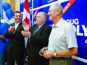 Then PC leader Tim Hudak (left), then mayor Rob Ford and candidate Doug Holyday during the official opening of Holyday's Etobicoke Lakeshore campaign headquarters  in Toronto July 8, 2013. (Ernest Doroszuk/Toronto Sun)