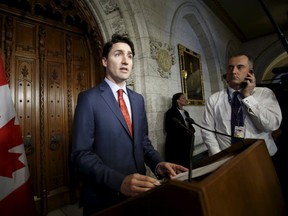 Canada's Prime Minister Justin Trudeau makes a statement about the Brussels attacks, on Parliament Hill in Ottawa, Canada, March 22, 2016. REUTERS/Chris Wattie