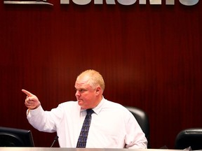 Mayor Rob Ford attends his first council meeting since returning from rehab at Toronto City Hall July 8, 2014. (Dave Abel/Toronto Sun)