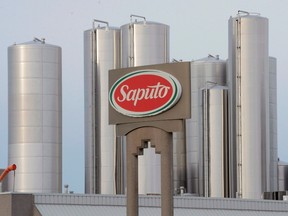 A sign at a Montreal Saputo plant is shown on Jan.13, 2014. Saputo Inc. says it will close three plants in Eastern and Atlantic Canada employing some 230 workers by the end of next year in a move to cut costs and boost efficiency. (THE CANADIAN PRESS/Ryan Remiorz)
