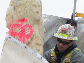Ben Strong, with Mattawa Industrial Services, operates a laser to remove graffiti from the Souls Memeorial on Tuesday March 22, 2016 in Point Edward, Ont. The company offered to help remove paint from the stone sculpture that was defaced by vandals earlier this month.
Paul Morden/Sarnia Observer/Postmedia Network