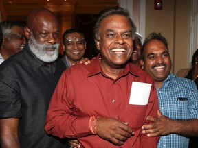 Liberal Bas Balkissoon, centre, celebrates an election win in his riding of Scarborough-Rouge River on June 12, 2014. (VERONICA HENRI/Toronto Sun)
