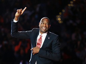 Former Atlanta Hawks’ Dikembe Mutombo reacts upon seeing his retired jersey number raised to the rafters during a ceremony Tuesday, Nov. 24, 2015, in Atlanta. (AP Photo/David Goldman)