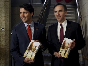 Prime Minister Justin Trudeau (L) and Finance Minister Bill Morneau walk to the House of Commons to deliver the budget on Parliament Hill in Ottawa on March 22, 2016. REUTERS/Patrick Doyle