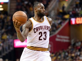 Cavaliers forward LeBron James look to pass during fourth quarter NBA action against the Nuggets at Quicken Loans Arena in Cleveland on Monday, March 21, 2016. (Ken Blaze/USA TODAY Sports)