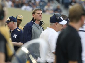 Winnipeg Blue Bombers head coach Mike O'Shea watches a replay on the video scoreboard during CFL action against the Edmonton Eskimos at Investors Group Field in Winnipeg on July 17, 2014. (Kevin King/Winnipeg Sun)