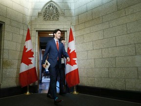 Canada's Prime Minister Justin Trudeau and Finance Minister Bill Morneau (R) walk from Trudeau's office to the House of Commons to deliver the budget, on Parliament Hill in Ottawa, Canada March 22, 2016.  REUTERS/Chris Wattie