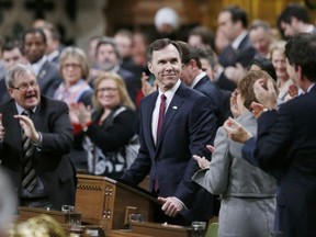 Chris Wattie/REUTERS
Canada's Finance Minister Bill Morneau is applauded as he delivers the federal budget in the House of Commons on Parliament Hill in Ottawa Tuesday.
