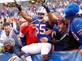 Buffalo Bills defensive end Jerry Hughes (55) celebrates with fans after recovering a fumble to score a touchdown against the Cleveland Browns at Ralph Wilson Stadium. (Kevin Hoffman/USA TODAY Sports)