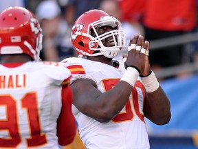 Kansas City Chiefs linebacker Justin Houston (50) celebrates a touchdown against the San Diego Chargers as linebacker Tamba Hali (91) looks on at Qualcomm Stadium. (Jake Roth/USA TODAY Sports)