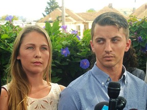 In this July 13, 2015, file photo, Denise Huskins, left, and her boyfriend Aaron Quinn listen as their attorneys speak at a news conference in Vallejo, Calif.  Attorneys for Huskins plan to file a claim against the city whose police initially dismissed her kidnapping as a hoax. Law firm Kerr and Wagstaffe has announced that its attorneys intend to file the claim, a precursor to a lawsuit, against Vallejo on Thursday, Sept. 17, 2015. (Mike Jory/Vallejo Times-Herald via AP, File)