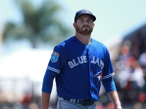 Toronto Blue Jays starting pitcher Drew Hutchison walks back to the dugout at the end of the first inning against the Detroit Tigers at Joker Marchant Stadium in Lakeland, Fla., on March 22, 2016. (Kim Klement/USA TODAY Sports)