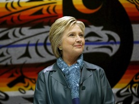 Democratic U.S. presidential candidate Hillary Clinton watches a performance during a roundtable discussion with Washington tribal leaders at Chief Leschi school in Puyallup, Washington March 22, 2016.  REUTERS/Mario Anzuoni