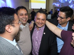 Supporters congratulate Prab Gill, PC candidate in Calgary-Greenway, who emerged victorious in a byelection in the riding Tuesday, March 22, 2016. (Gavin Young/Postmedia)