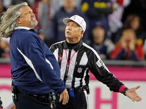 Dallas Cowboys defensive coordinator Rob Ryan (L) argues with referee Walt Coleman about a penalty call during the second half of their NFL football game against the New England Patriots in Foxborough, Massachusetts October 16, 2011. REUTERS/Adam Hunger