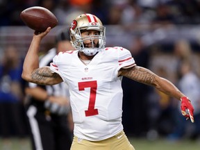 In this Nov. 1, 2015, file photo, San Francisco 49ers quarterback Colin Kaepernick throws during the first quarter of an NFL football game against the St. Louis Rams, in St. Louis. 49ers quarterback Colin Kaepernick has a torn ligament in the thumb on his throwing hand and surgery has been recommended.  (AP Photo/Tom Gannam, File)