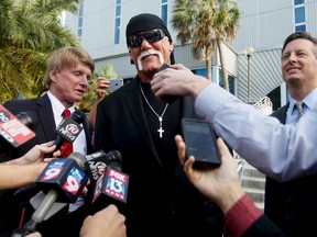 Hulk Hogan, whose given name is Terry Bollea, speaks to the media after a jury returned its decision Monday, March 21, 2016, in St. Petersburg, Fla.  (Dirk Shadd/The Tampa Bay Times via AP)