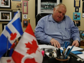 Toronto mayor Rob Ford was in his office late last night going through letters, taking care of business. He talked about a a woman who was hit and killed by a TTC streetcar (which may have been a suicide) and one his own longevity dealing with upcoming chemo for his cancer on Tuesday September 30, 2014. Jack Boland/Toronto Sun